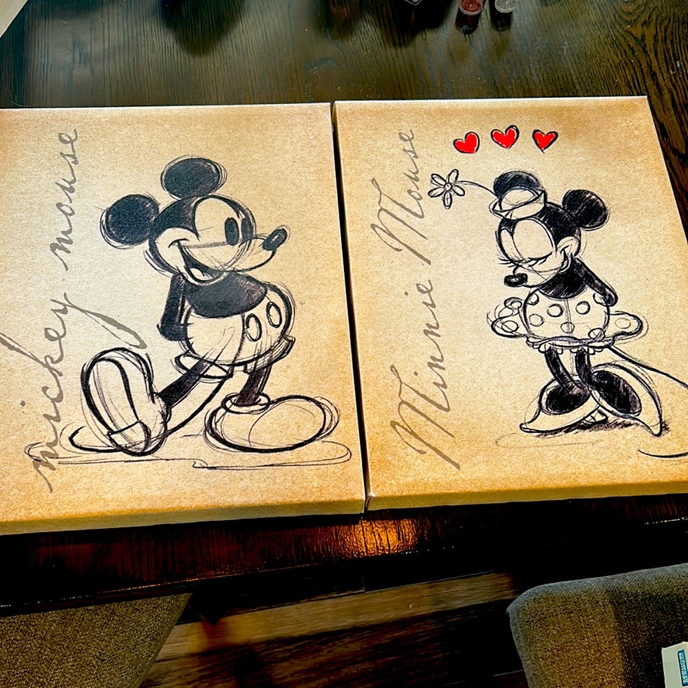 2 canves posters with Mickey and Minnie Mouse.